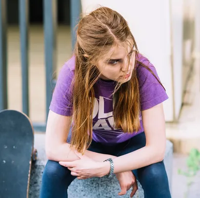 Teenage girl with hyperactive ADHD struggling with restlessness and emotional regulation