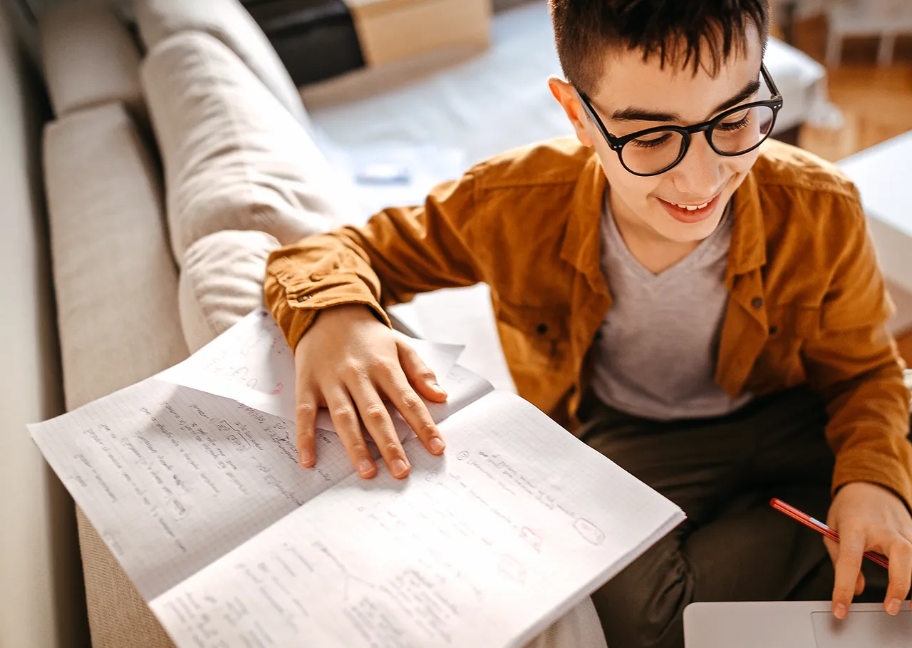 Confident teen with ADHD showing improved self-esteem after successful coaching sessions