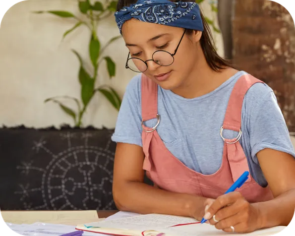 Teen girl using a timer and studying with focus