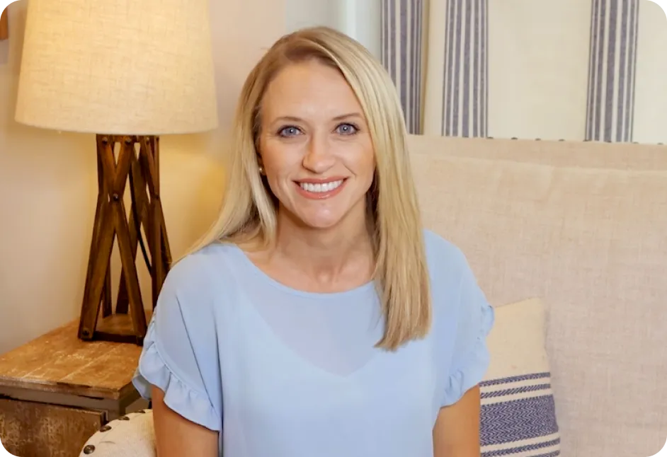 Blonde mother in blue dress smiling